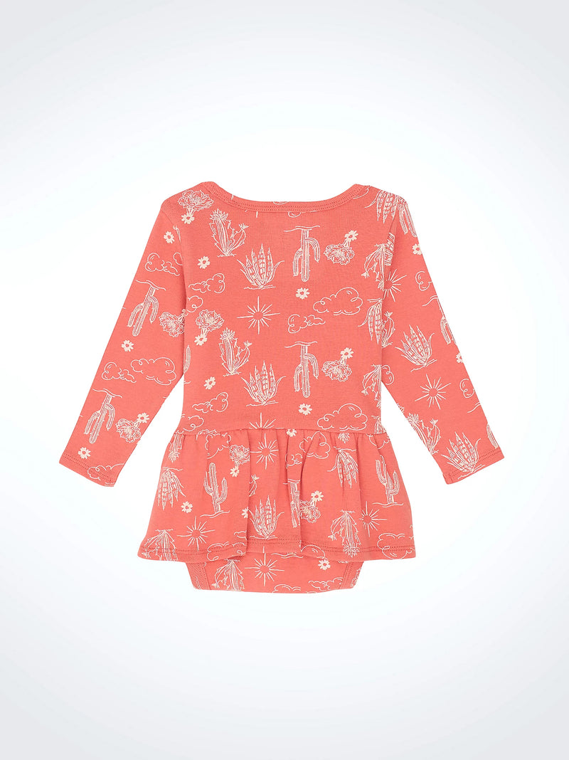 Coral dress with white patterns on a white background