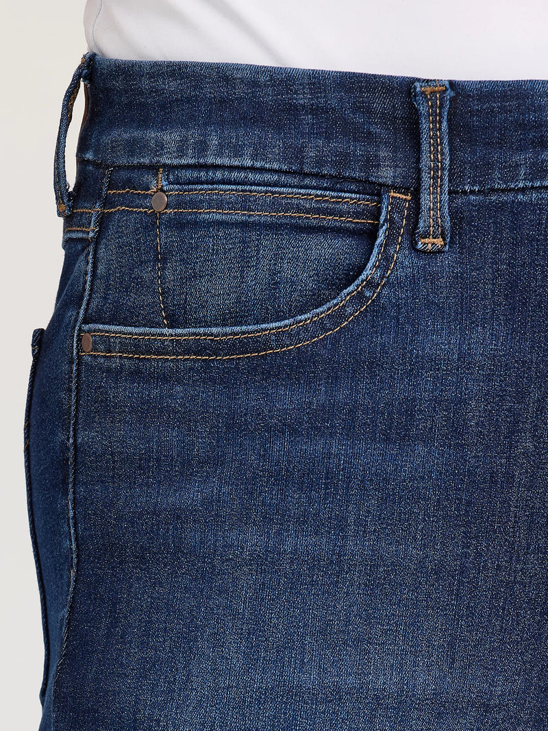 Close-up of blue jeans with a plain background