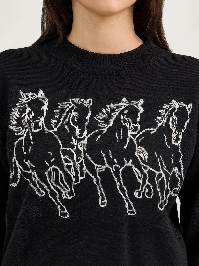 Black sweater with white horse design worn by a person