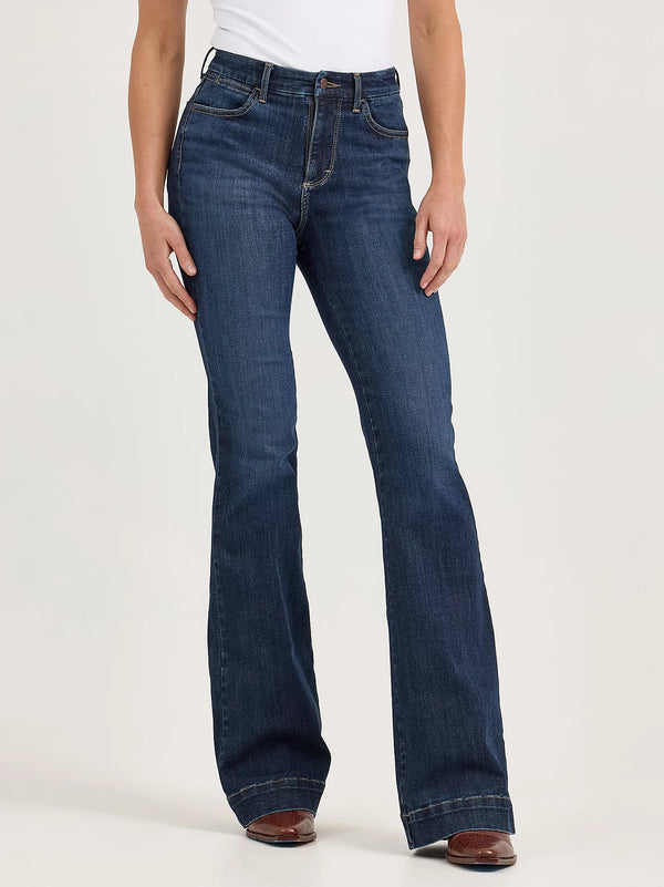 Person wearing blue jeans on a white background