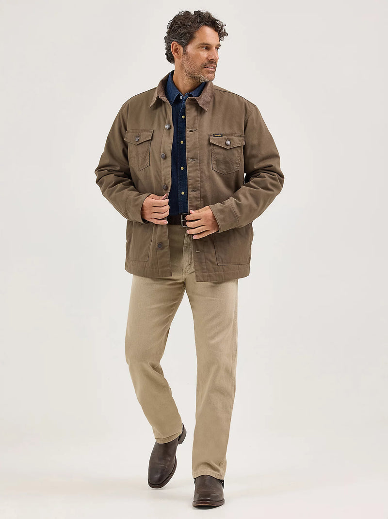 Man wearing a brown jacket and beige pants on a white background