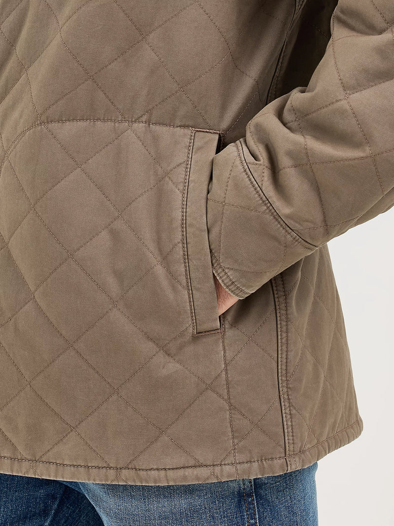 Quilted jacket with diamond pattern on a plain background