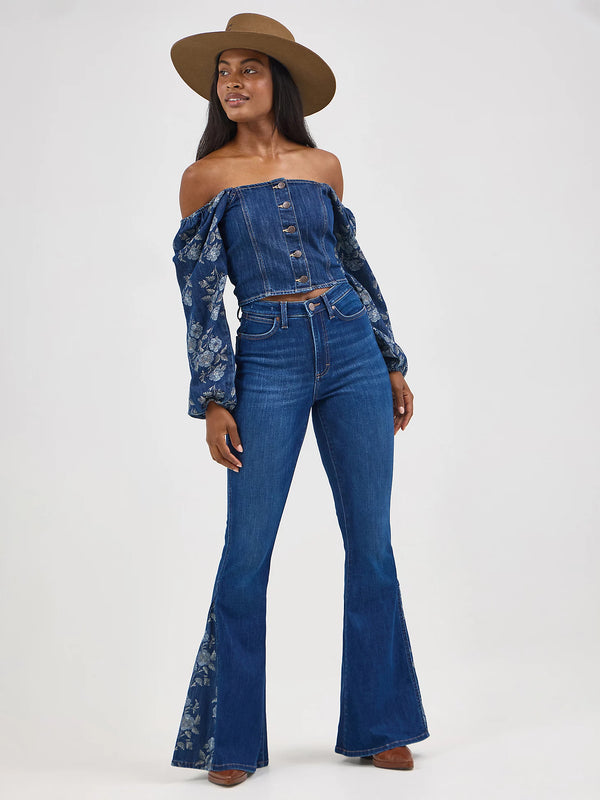 Woman wearing a denim outfit with a hat on a white background