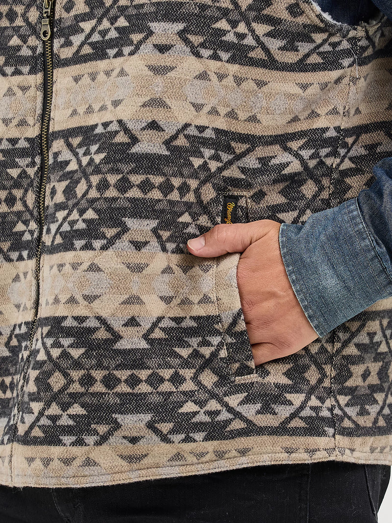 Patterned jacket with a hand opening a pocket