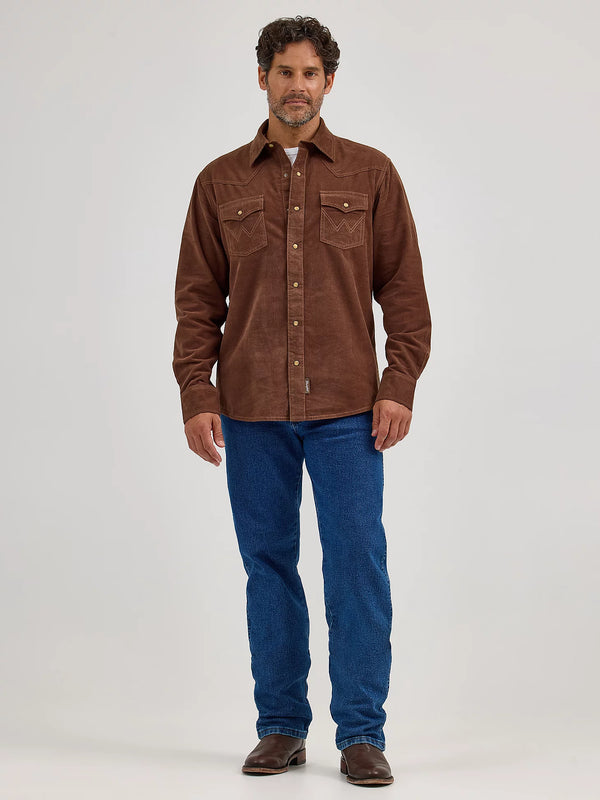 Man wearing a brown jacket and blue jeans on a white background