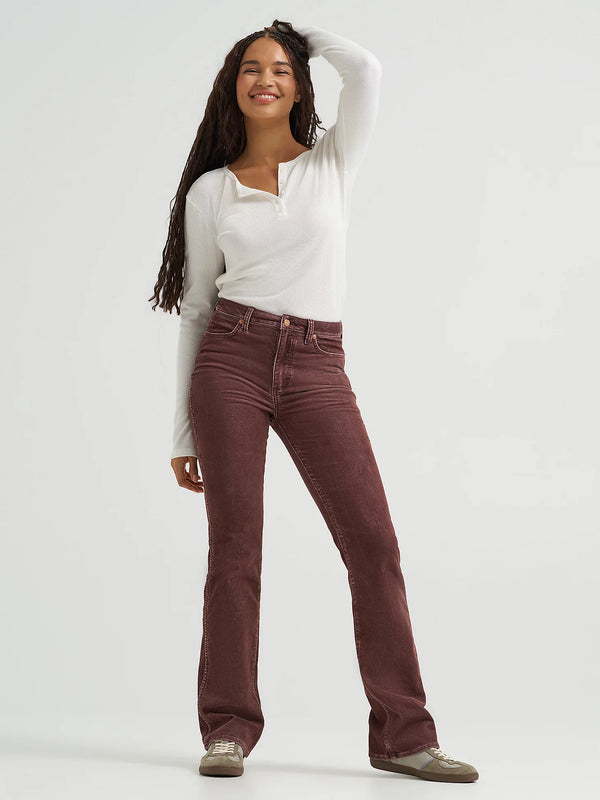 Woman wearing brown pants and a white shirt on a white background