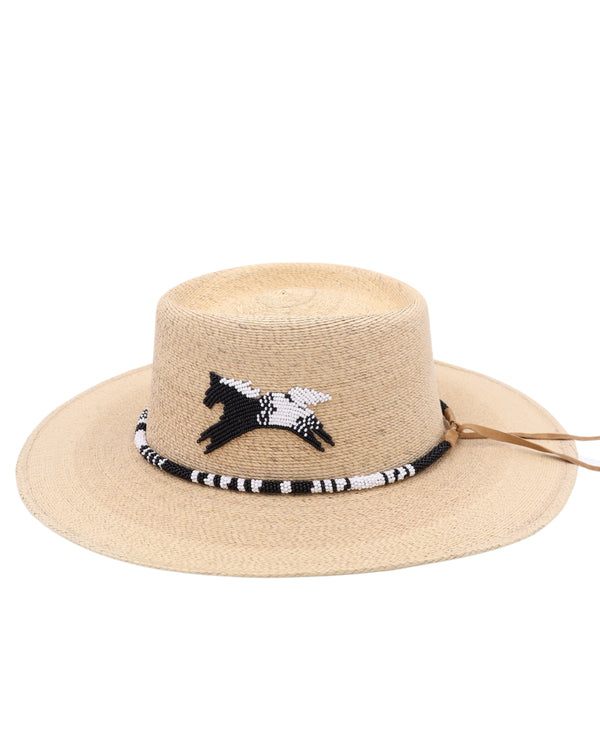 Straw hat adorned with a hand strung black and white beaded hatband, this hat is perfect for any occasion. Show off your funky spirit with the white and black horse design on the crown.
