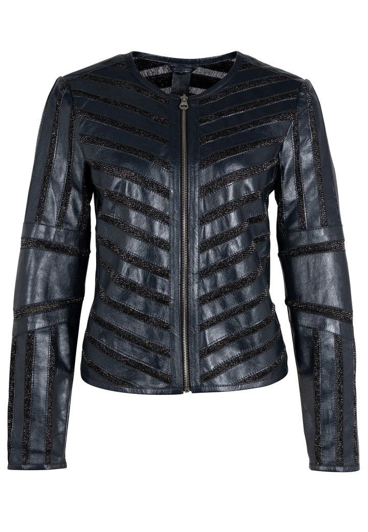 Woman wearing blue leather jacket with shimmery accents. Zip front leather jacket