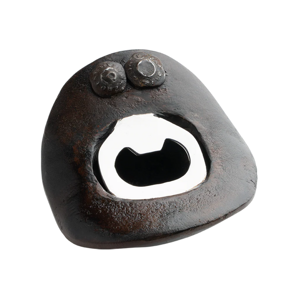 Rustic metal bottle opener on a white background