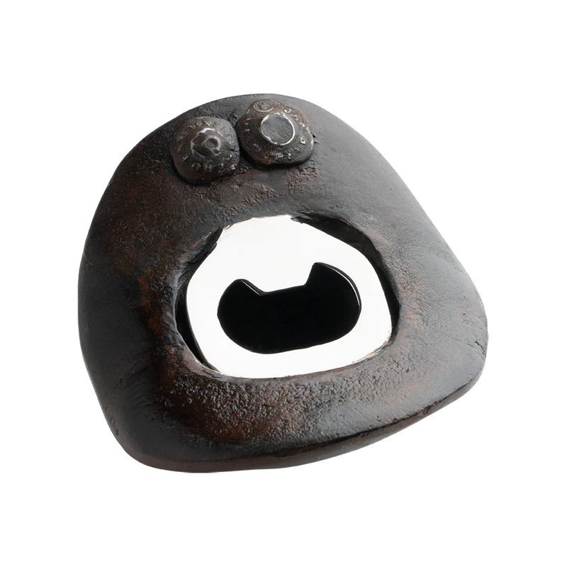 Rustic metal bottle opener on a white background