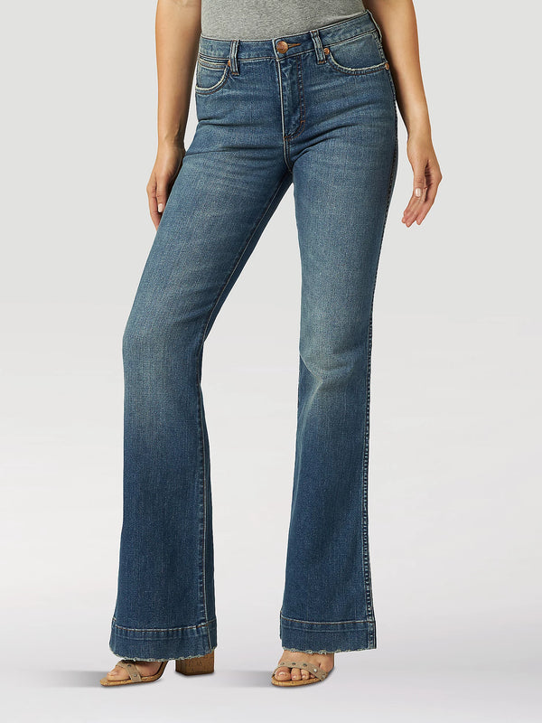 Woman wearing high rise fair medium wash jeans