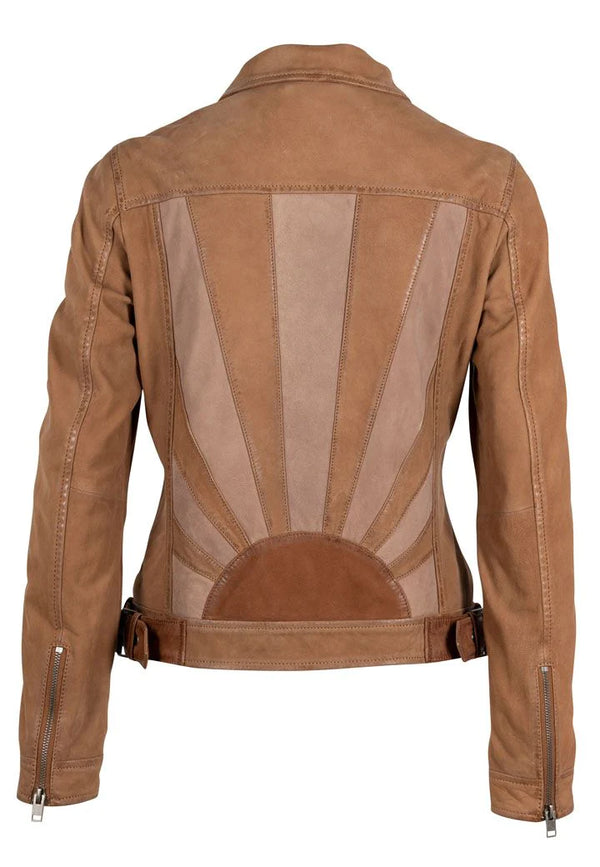 Woman wearing tan leather jacket with neutral sun design on the back