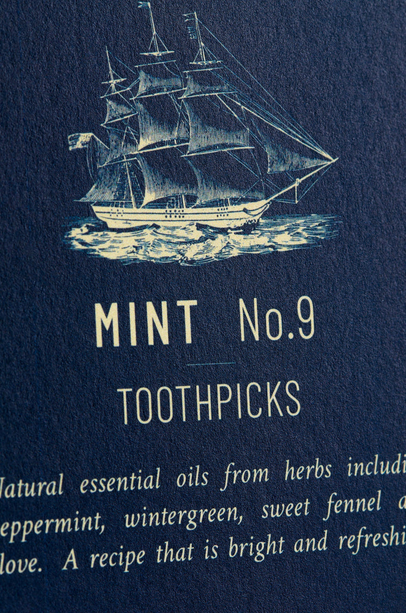 Mint flavored toothpicks in amber glass cases