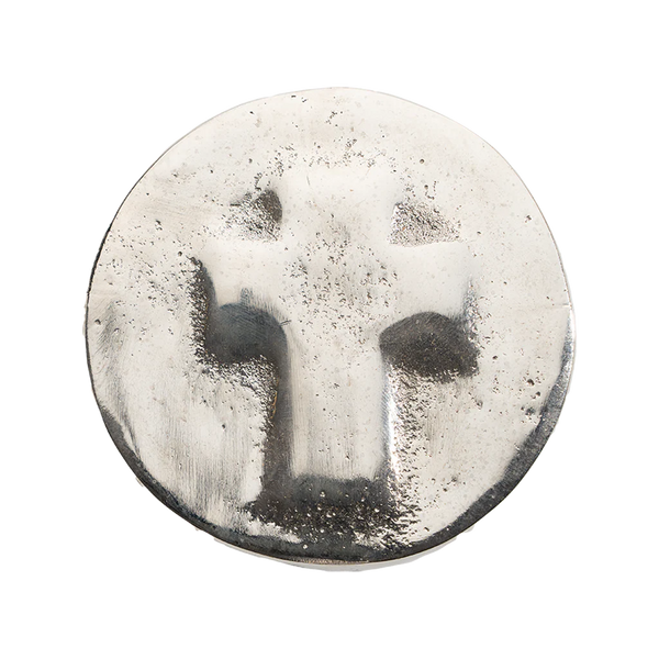 Round ceramic plate with a textured surface on a white background