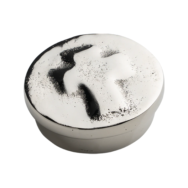 Round container with black and white marbled top on a white background