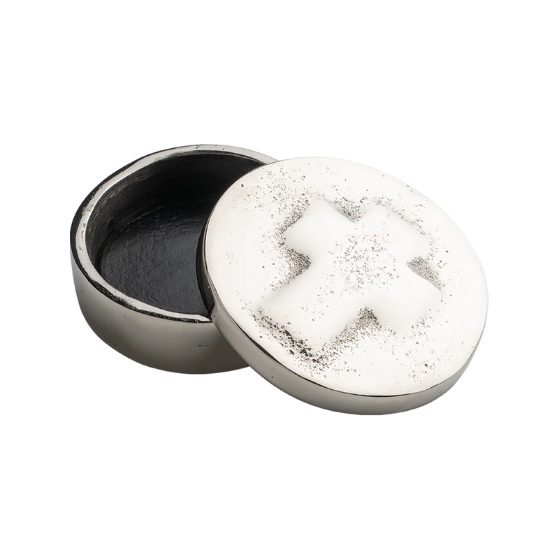 Round metallic container with a textured surface on a white background