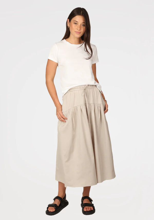 Woman wearing khaki color midi skirt with drawstring and pockets