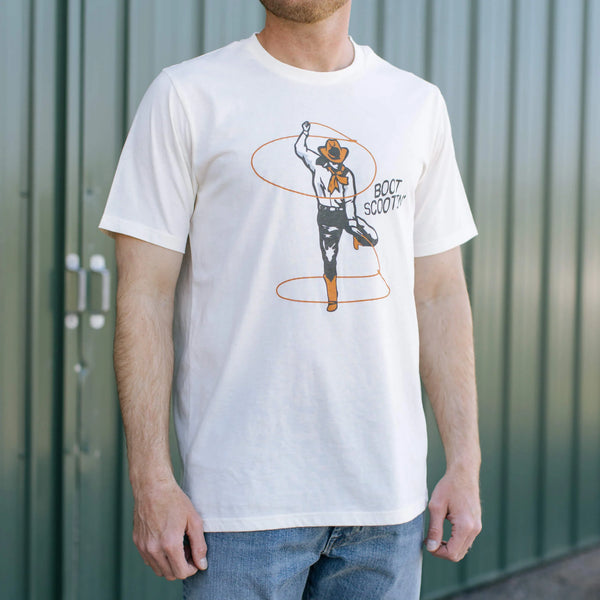 SENDERO BOOT SCOOTIN' T-SHIRT White with a cowboy dancing with 2 lassos and the words "Boot Scootin'"  on the left of the cowboy