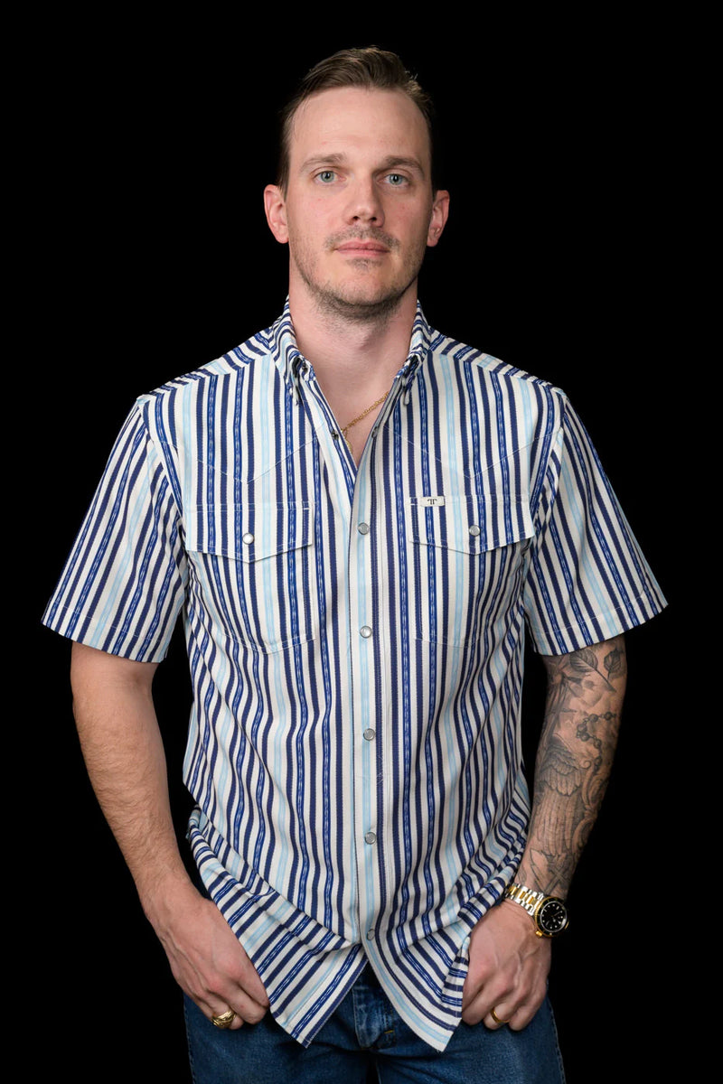 Man wearing a blue and white striped shirt against a black background