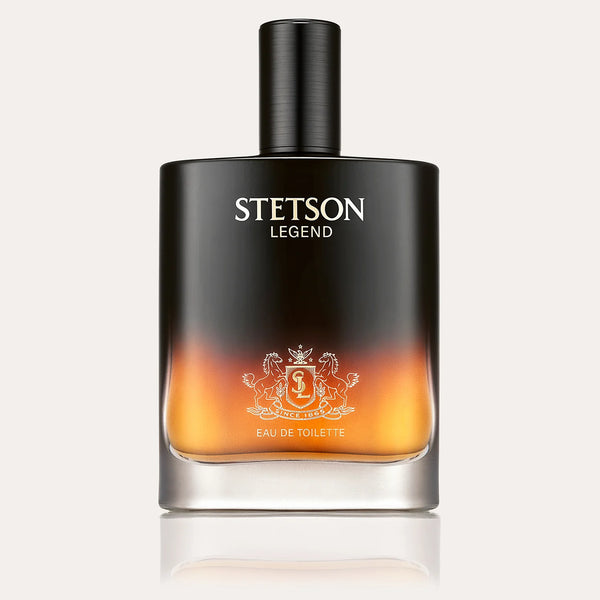 Men's cologne in a black square bottle with orange flame like appearance at the bottom. 