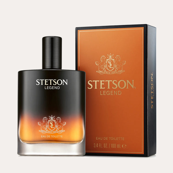 Men's cologne in a black square bottle with orange flame like appearance at the bottom.