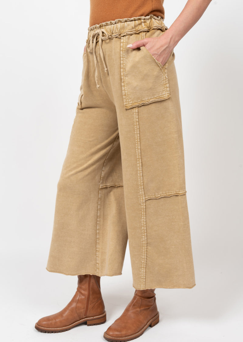 Woman wearing drawstring pants with dramaticly large pockets