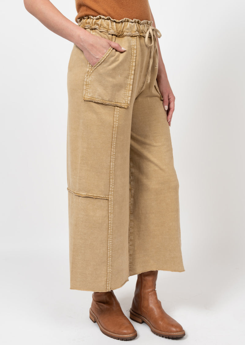 Woman wearing drawstring pants with dramaticly large pockets