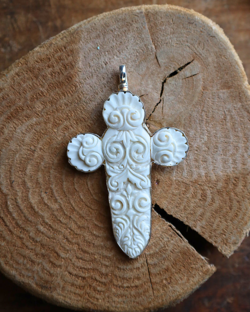 COREEN CORDOVA CROSS WHITE CARVED WITH SPIRALS PENDANT