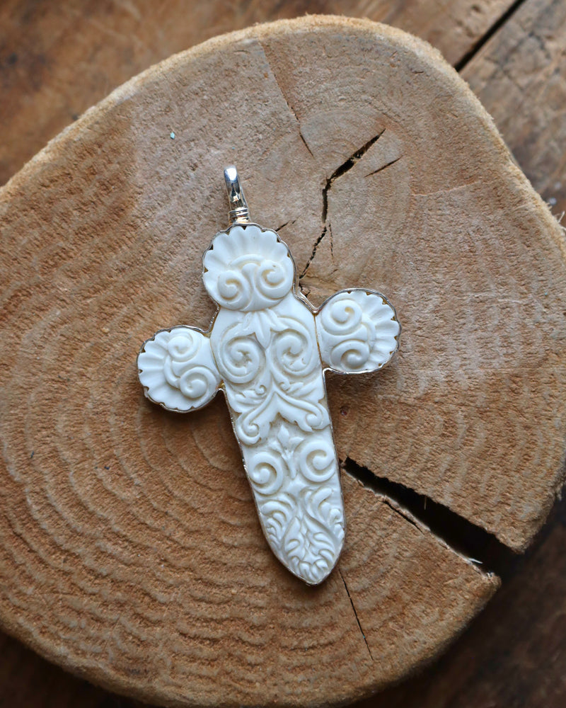 COREEN CORDOVA CROSS WHITE CARVED WITH SPIRALS PENDANT