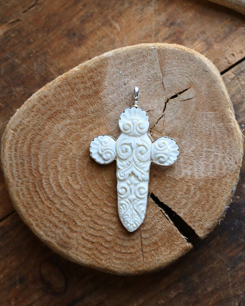 COREEN CORDOVA CROSS WHITE CARVED WITH SPIRALS PENDANT