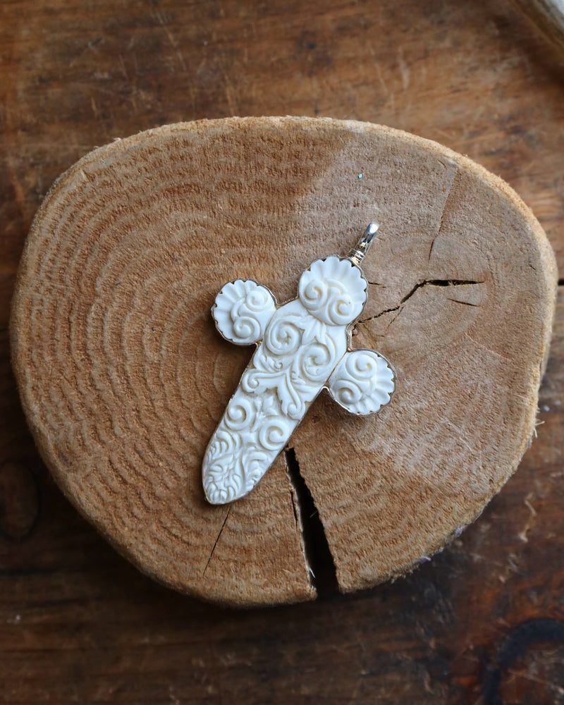 COREEN CORDOVA CROSS WHITE CARVED WITH SPIRALS PENDANT