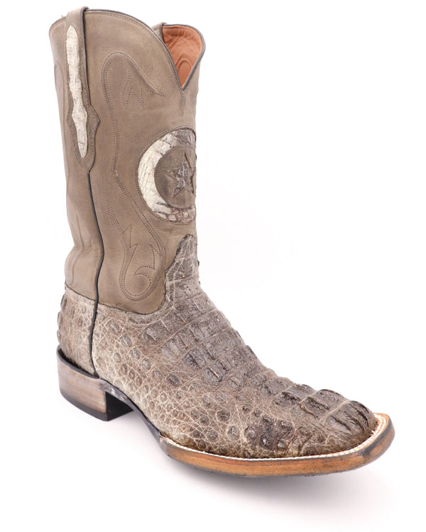 The vamp is constructed of rugged hornback caiman leather with a natural finish. The shaft is constructed of dark brown leather with a lone star inlay in the front