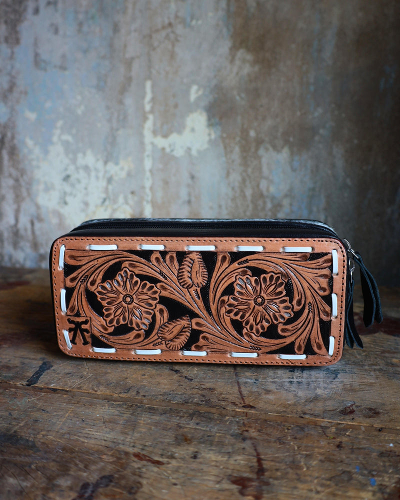 Mini plus travel jewelry case with floral tooled leather and white bucksitich lacing top, with hair on cowhide, black leather or dark chocolate brown leather with black velvet interior.