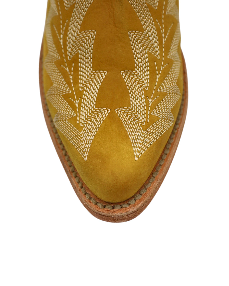 Yellow bootie with elastic side and western stitching on both front and back of the boot