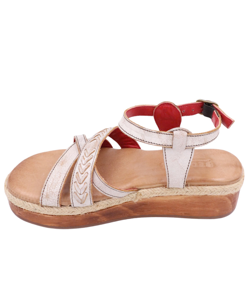 Platform sandal with white leather straps on the top of the foot and strap around the ankle