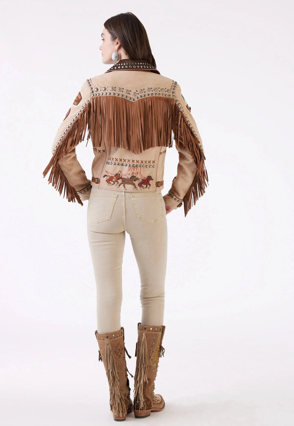 Woman wearing tan suede patch jacket with fringe and studs