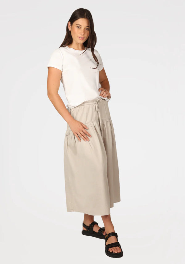 Woman wearing khaki color midi skirt with drawstring and pockets
