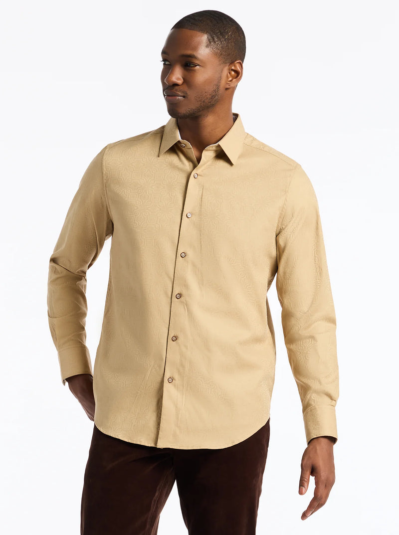 Man wearing a beige button-up shirt on a white background