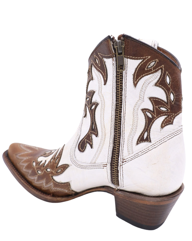 7.5 inch cowgirl booties in a pearly white leather with browl leather overlay. This is a snip toe bootie with zipper for easy access