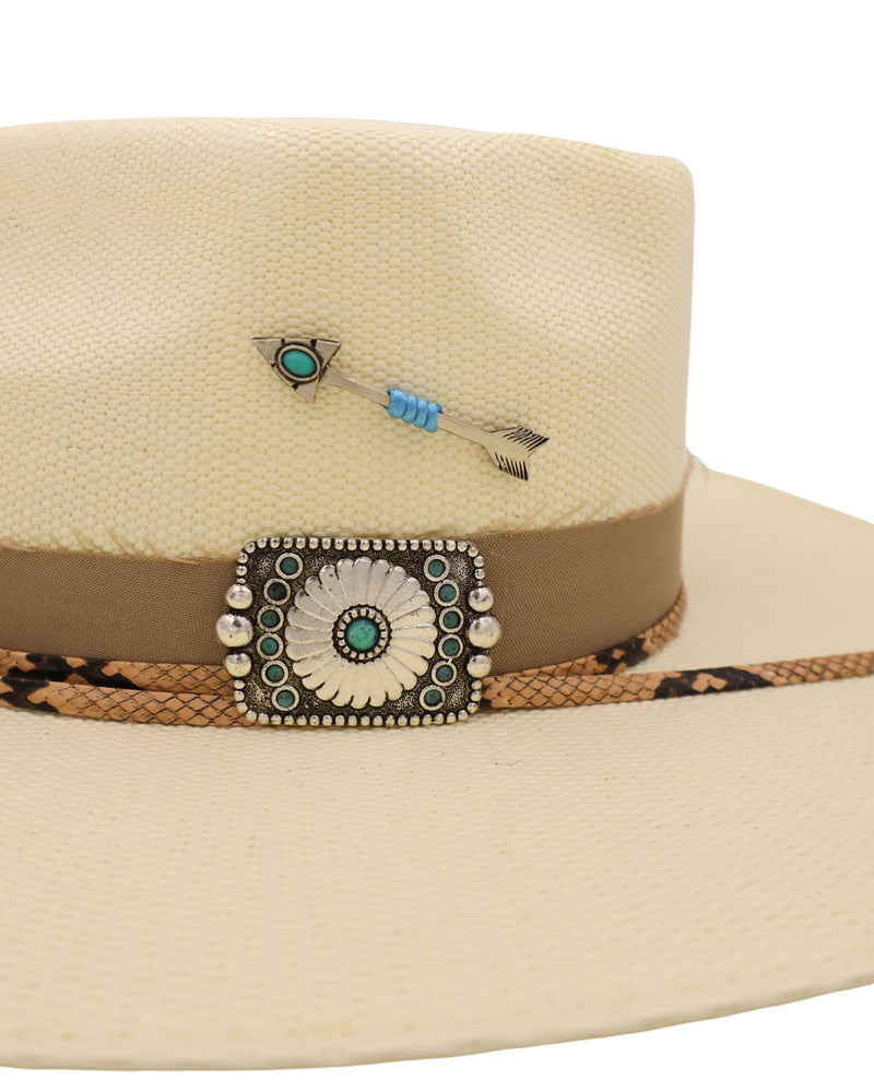 Straw flat brim hat with speak design on the crown, snake print cord, tan cloth hat band, concho on side of hat as well as silver arrow with turquoise on charm