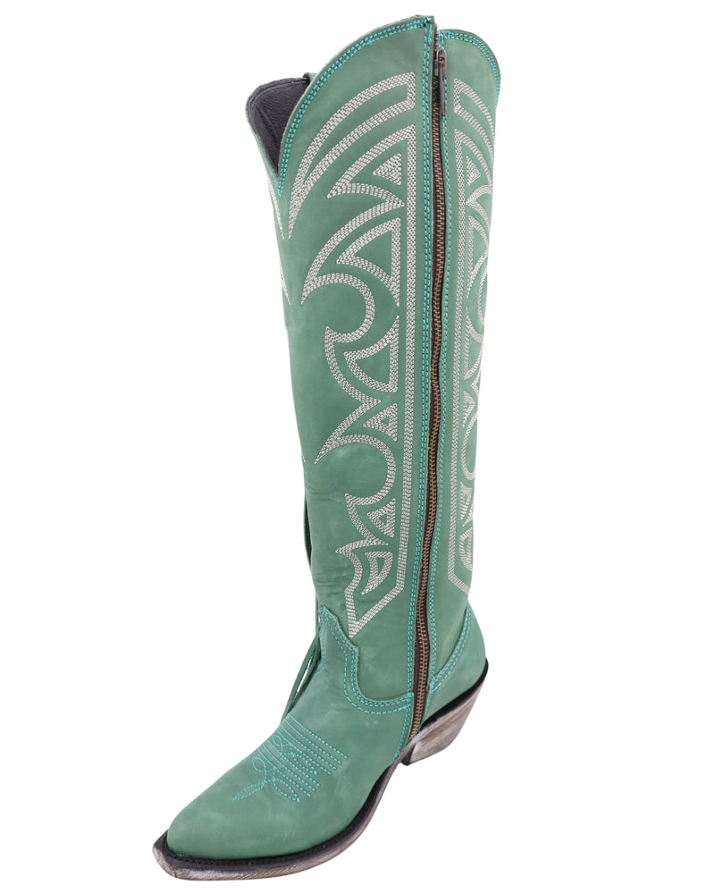 Turquoise cowgirl boot with fringe, white stitching and zipper on the inside of the boot