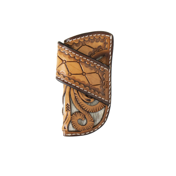 leather knife sheath that is tooled in a diamond and floral western pattern with cowhide under