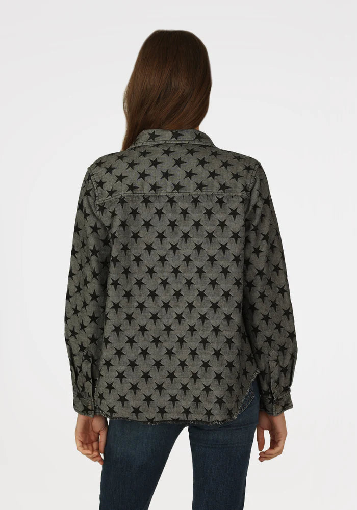 Woman wearing grey jacket with black stars all over with double breast pockets