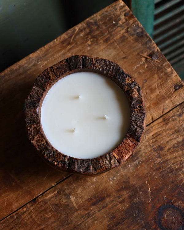 Candle in mango wood bowl