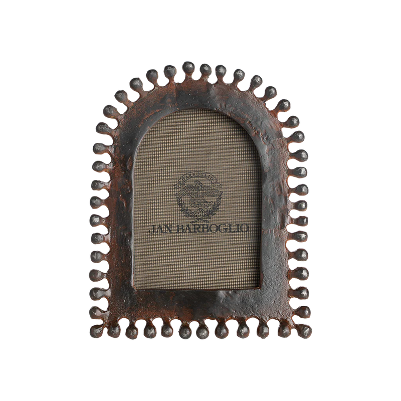 Decorative metal picture frame with a textured border on a white background