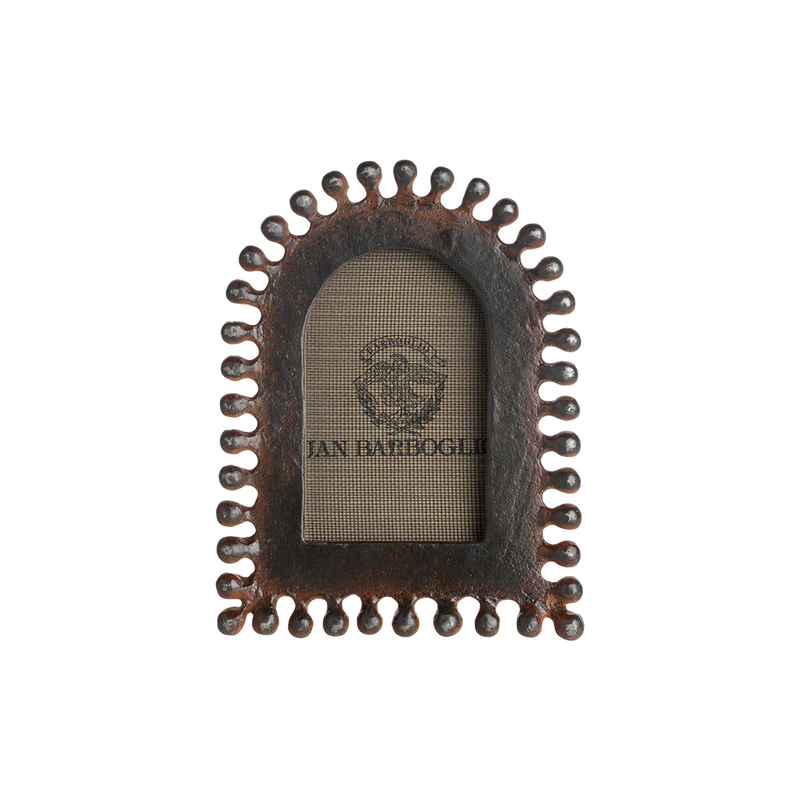 Decorative metal frame with a textured border on a white background