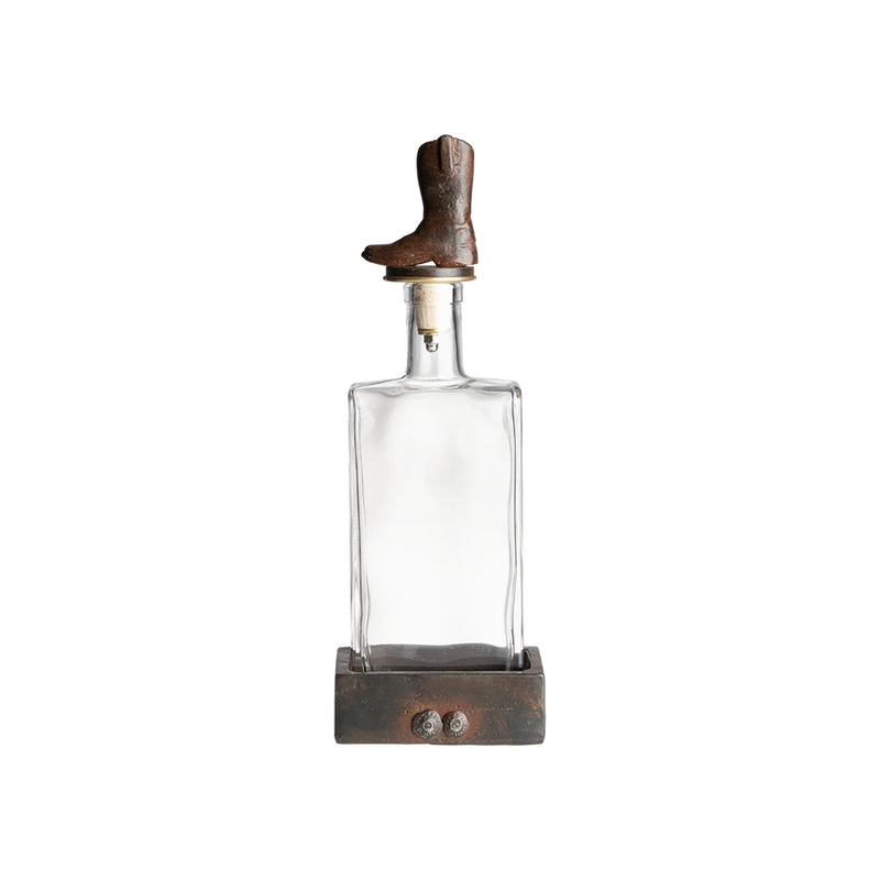 Clear glass bottle with wooden cap on a white background
