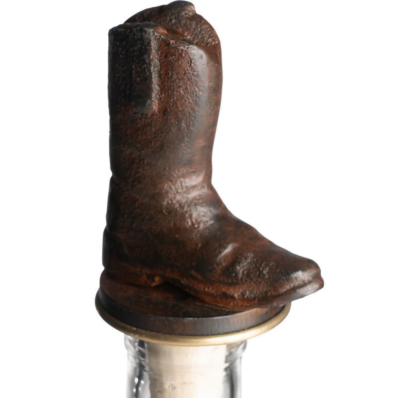 Brown cowboy boot bottle stopper on a white background