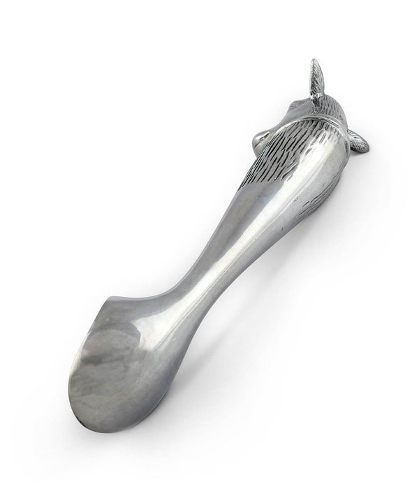 Silver ice cream scoop with cow head on the end of it