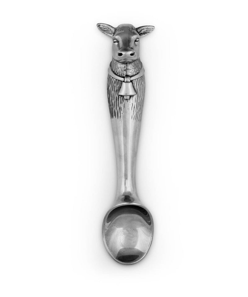 Silver ice cream scoop with cow head on the end of it